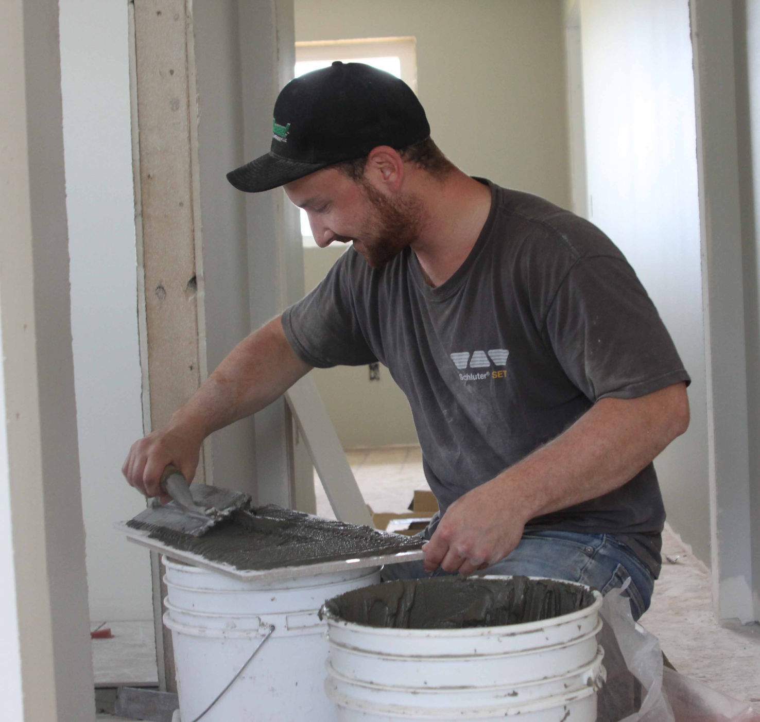 Tyler installs tile 2
